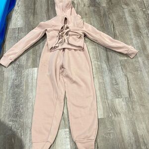 A pink two-piece sweatsuit